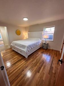 Ένα ή περισσότερα κρεβάτια σε δωμάτιο στο Alfred St Air BNB