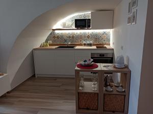 Cuisine ou kitchenette dans l'établissement A Casa di Fede