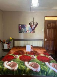 a bedroom with a bed with pink flamingos on it at Riambel Paradise Inn Primary Apartment in Riambel