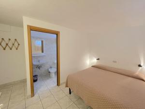 Postel nebo postele na pokoji v ubytování Le camerine