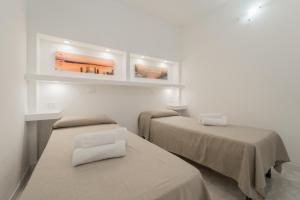 Кровать или кровати в номере Residence Cala Silente