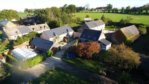 an aerial view of a house with a yard at Au cottage normand in Saint-James