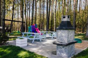 Ogród w obiekcie Nadmorska Przystan Domki - Basen, sala zabaw, rowery, animacje
