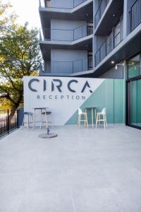 a sign for a group reception on the side of a building at Circa Aparthotel by Totalstay in Pretoria