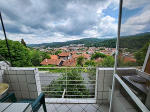 a balcony with a view of a city at Апартамент Панорамна гледка in Tryavna