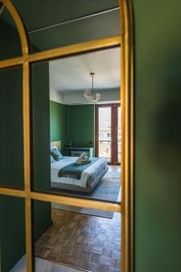 a bedroom with a bed and a mirror at Gaby Lake Suites in Como