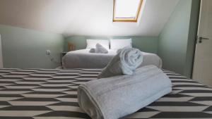 Voodi või voodid majutusasutuse Coastal View House toas