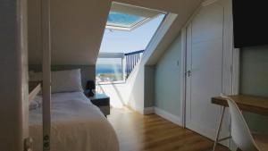 Voodi või voodid majutusasutuse Coastal View House toas