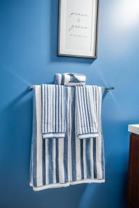 two towels hanging on a towel rack in a bathroom at Beautiful Condos In the Heart of Downtown by GLOBALSTAY in Toronto