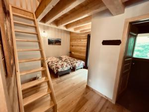 Letto o letti in una camera di Gîte Chalet La Vie Sauvage