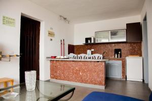 A kitchen or kitchenette at Apartamentos Miriam