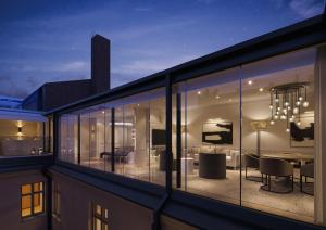 a balcony with a view of a living room at The Hotel Maria - Preferred Hotels & Resorts in Helsinki