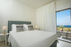 Postel nebo postele na pokoji v ubytování Villa Ariadne + 37 fotografií