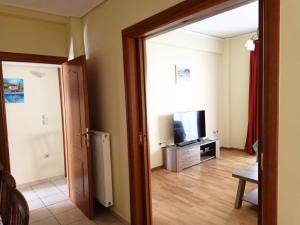 a room with a door open to a living room at Big Apt 3bed 3bath 10 min walk Acropolis in Athens