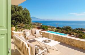 a villa with a view of the ocean at The Yiameli Collection - Levandi in Skinária