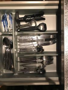 a drawer full of utensils and scissors at ビラ里山双林 in Inashiki