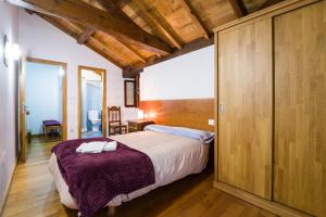 Giường trong phòng chung tại Casa D'Abaixo