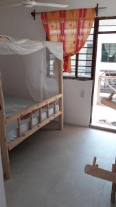 Postel nebo postele na pokoji v ubytování New Iddi Villa