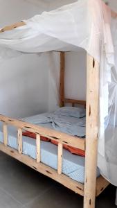 Postel nebo postele na pokoji v ubytování New Iddi Villa