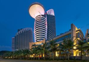 a tall building with a dome on top of it at Sheraton Zhanjiang Hotel in Zhanjiang