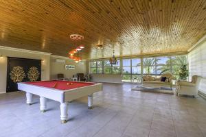 a large room with a pool table in it at Sea View Terrace Big Villa w Pool 5 min to Beach in Seki