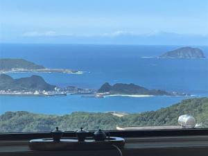 a view of the ocean from a kitchen window at 95 Pavilion in Jiufen