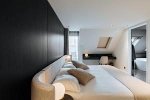 Cosmopolite Hotel Nieuwpoort-Badにあるベッド
