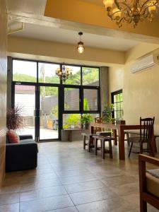 a living room with a table and a dining room at 白砂灣藍海之丘Blue Ocean Hill in Hengchun South Gate