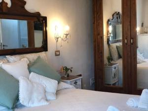 a bedroom with a large mirror and a bed at Jess & Joe's in Castelvetrano Selinunte