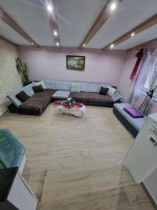 a living room with a couch and a table at Mountain Pearl in Maurach