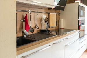 a kitchen with a sink and a stove at Gästehaus Franz in Goslar