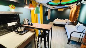 a room with a kitchen and a living room at Smile Hotel Balakong Kajang in Cheras +23 photos