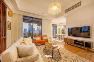Posezení v ubytování Manzil - Cozy 2BR Penthouse with Private Terrace and Full Burj View in Downtown