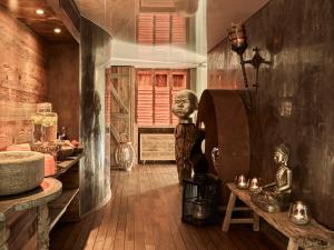 a room with a statue of a head on the wall at Firefly Luxury Suites in Zermatt