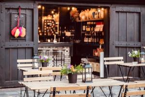a group of tables and chairs in front of a store at Molino Tejada in Polientes