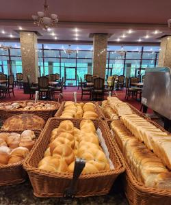 a display of breads in baskets in a restaurant at Hotel Piatra Mare in Poiana Brasov