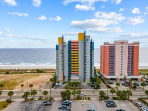 a group of tall buildings next to the ocean at Ocean Front 2BR Elegant Condo in Atlantica Resort in Myrtle Beach