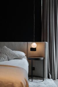 Cosmopolite Hotel Nieuwpoort-Badにあるベッド