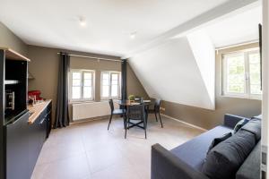 a living room with a couch and a table at La Fattoria Casa DOLCE in Unterflockenbach