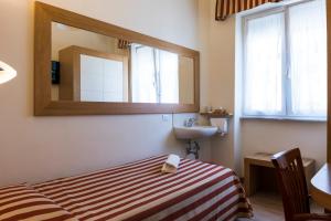 Postel nebo postele na pokoji v ubytování Hotel Sylvia
