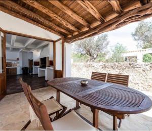 a dining room with a table and chairs at Villa Elena in Sant Josep de sa Talaia