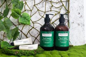 two bottles of liquid sitting on top of green moss at ANA Crowne Plaza Kanazawa by IHG in Kanazawa