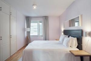 Postel nebo postele na pokoji v ubytování Norden Homes Central 2-Bedroom Apartment