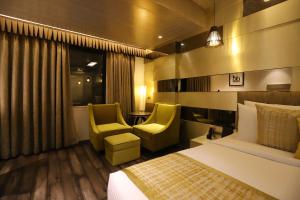 Letto o letti in una camera di The Pristine Hotel