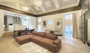 a living room with a couch and a table at Unique 3 Bedroom Flat in Vibrant Frederiksberg in Copenhagen