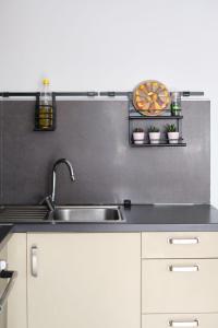 a kitchen with a sink and a counter top at Taxim home with terrace in Istanbul