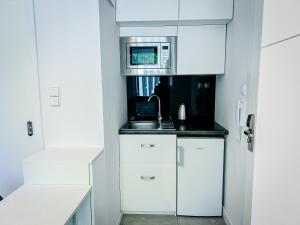 Kuchyňa alebo kuchynka v ubytovaní TPS Apartamenty Olimpijskie