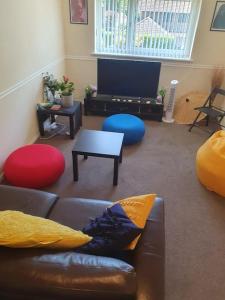 a living room with a couch and a tv at 1bedroom flat wt ext sofa chair in Horsham