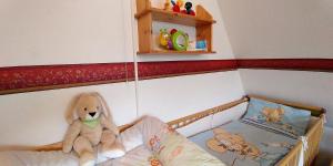 Ein Bett oder Betten in einem Zimmer der Unterkunft Ferien am Biotop