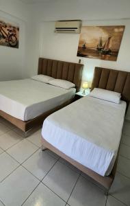Postel nebo postele na pokoji v ubytování Hotel de Ksamil